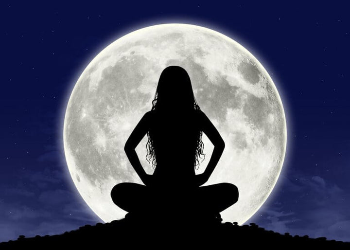cosmic witchcraft meditating with moon